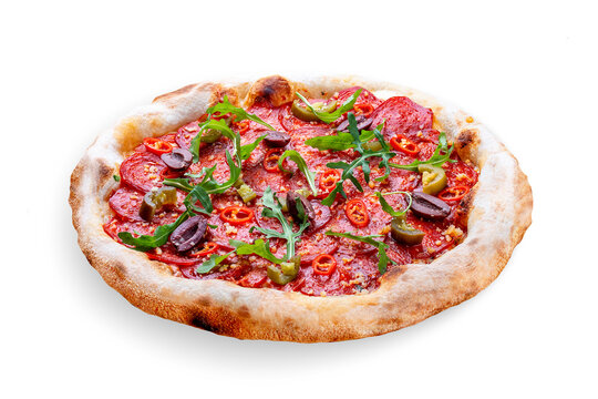 Pizza Diavolo with chorizo, rucola, jalapeno, chili, kalamata, pesto. Neapolitan round pizza on white background