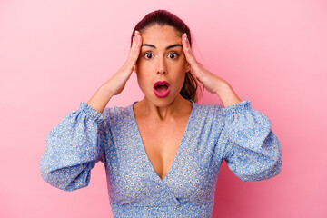 Young caucasian woman isolated on pink background