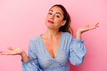 Young caucasian woman isolated on pink background