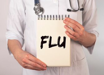 Flu or influenza inscription, word in doctor hands.