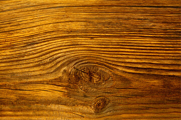 Old dilapidated pine wooden board on the wall.