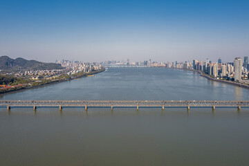 Fototapeta na wymiar Aerial view of Qiantang River Bridge and modern city skyline in Hangzhou, China