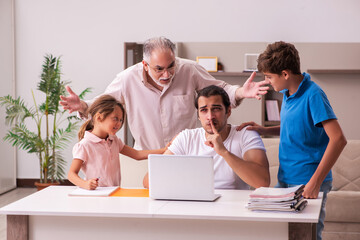 Obraz premium Three generations at home during pandemic