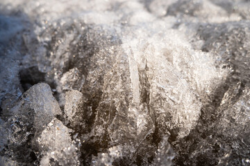 Background image. Cracked ice covering the ground.