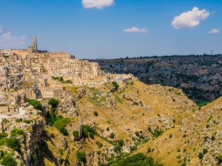 Fototapeta na wymiar Suggestive view of the ancient town of Matera and its spectacular canyon, Basilicata region, southern Italy 