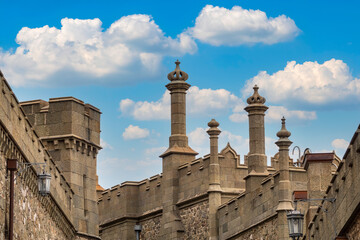 Fototapeta premium The walls of the old palace on the background of a blue sky