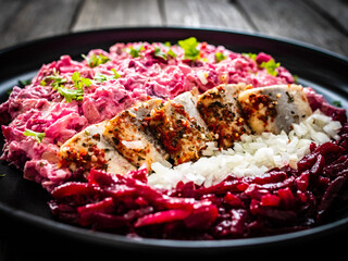 Marinated herring fillets in cream with roast beetroots, pickled cucumber, boiled potatoes,...