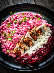 Marinated herring fillets in cream with roast beetroots, pickled cucumber, boiled potatoes,...