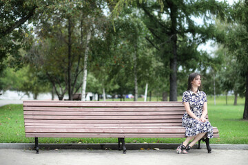 Obraz premium Beautiful girl in dresses for a walk