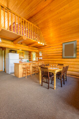 Modern dining room in log cabin or luxury house.