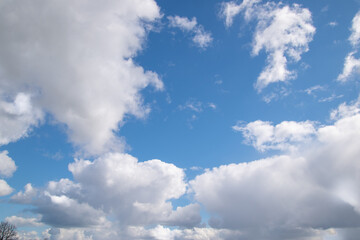 Naklejka na ściany i meble White and gray clouds in the blue sky.