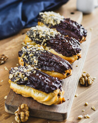eclair with chocolate cream and nuts