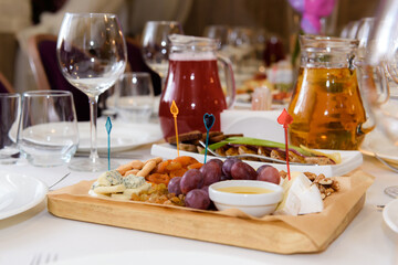 Festive table with fruit. Served food and cutlery.