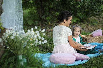 Fototapeta premium mother with daughter at a picnic