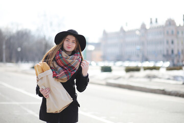 French woman with baguettes in the bag