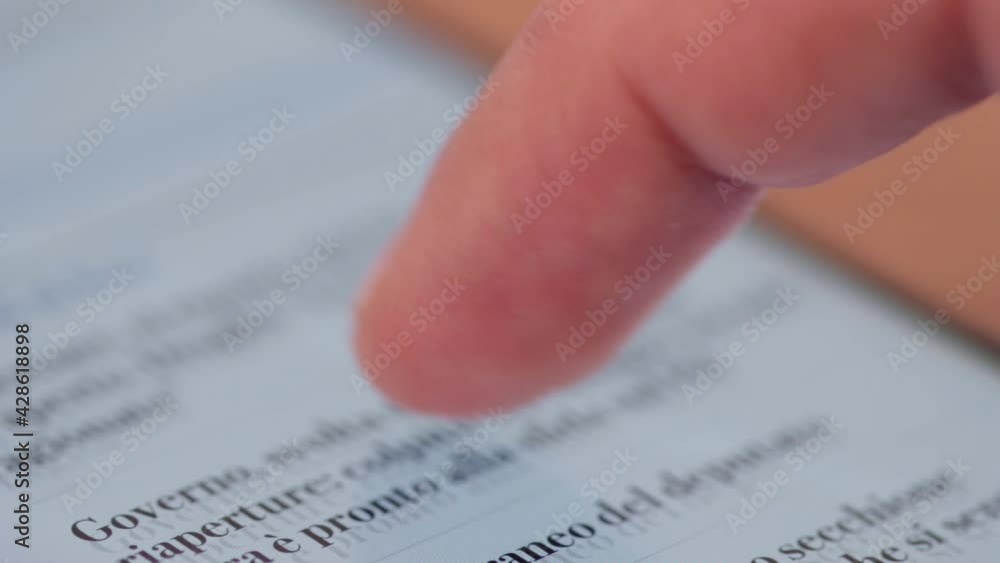 Poster scrolling news on smartphone screen with finger. close up of smartphone action. news feed scroll