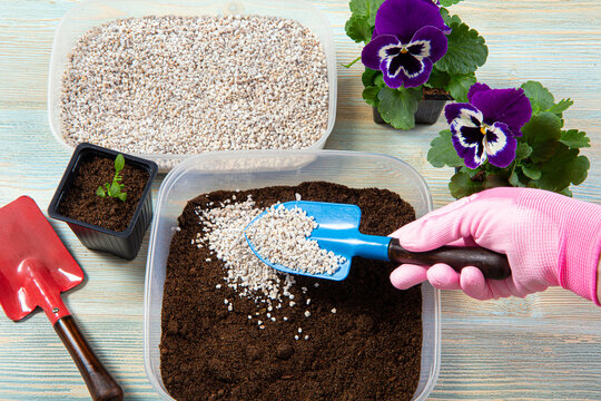Mixing perlite granules pellets with black gardening soil improves water retention, airflow, aeration, root growth capacity of all the plants growing in pots.  Perlite is an amorphous volcanic glass.