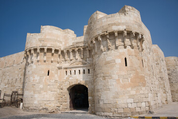Fototapeta premium Citadel of Qaitbay with it´s gate in old part of Alexandria, Egypt