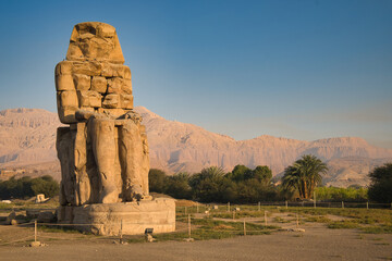 Colossi of Memnon with statues of  Pharaoh Amenhotep III in Theban Necropolis in Luxor, Egypt