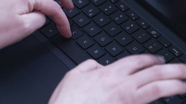 Typing keyboard laptop, developer at work building software. Hands typing on notebook keyboard.