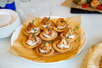 canapes with shrimp. A convenient buffet feed. little sandwiches at the festival. Catering. delivery of ready meals and service of banquets.