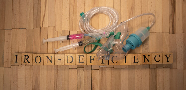 Iron deficiency. It was prepared from wooden cubes. White background.