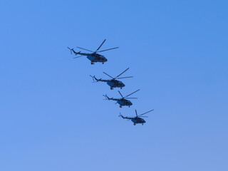 Russia, St. Petersburg - June 24, 2020: Russian military helicopters Mi-8 of the Russian Air Force in flight at the Victory Parade in World War II.