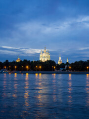 Obraz premium Russia, St. Petersburg - July 19, 2020: View of the Smolny Cathedral from the Neva at night on a cloudy summer day. Russia, Saint-Petersburg
