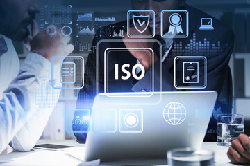 Two businessman working on laptop and researching international