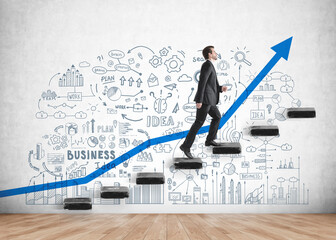 Young businessman wearing formal suit is going upstairs for promotion