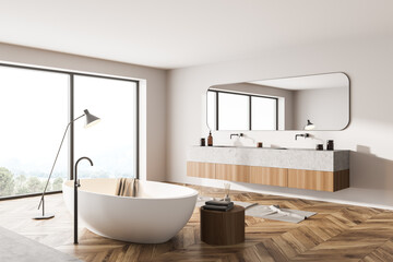 Bathroom interior with two sinks and windows on countryside