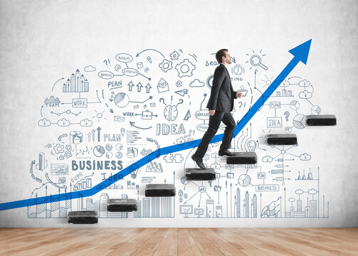Young businessman wearing formal suit is going upstairs for promotion