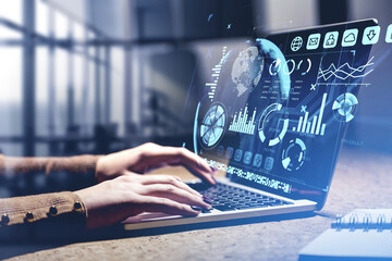 Businesswoman hands with laptop, hud with earth globe and digital icons