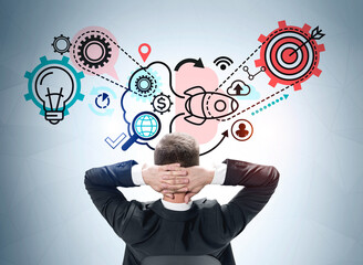 Businessman is looking at sketch and thinking about creative idea