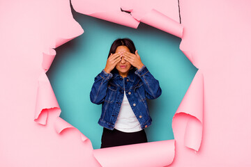 Young mixed race woman behind a broken background having a strong teeth pain, molar ache.