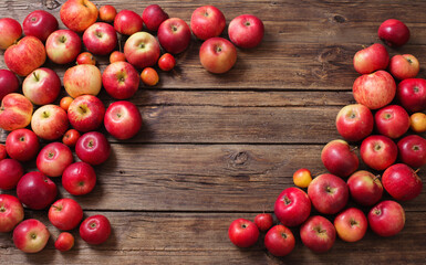 red apples on old wooden background