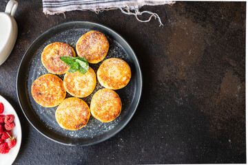 pancakes curd breakfast cottage cheese dessert cheesecake sweet syrniki healthy meal top view copy space rustic food background