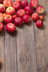 red apples on old wooden background