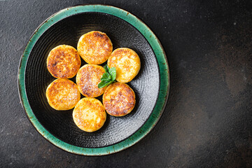 pancakes curd breakfast cottage cheese dessert cheesecake sweet syrniki healthy meal top view copy space rustic food background