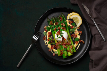 Green asparagus, with poached egg and bacon, hollandaise sauce, top view, horizontal, no people,