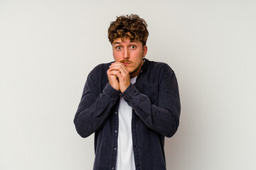 Young caucasian man isolated on white background scared and afraid.