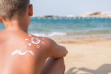 Sunscreen in Form of Sun and Waves on Skin of Boy Summer Sunny Day For Travel