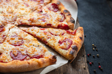 pizza sausage tomato sauce cheese trend fast food meal copy space rustic food background 