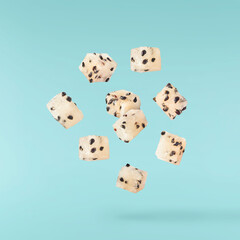 creative image with fresh yellow pitaya falling in the air, zero gravity food conception