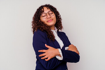 Young business mixed race woman isolated on white background hugs, smiling carefree and happy.