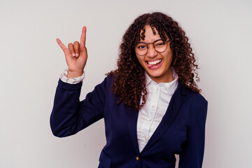 Young business mixed race woman isolated on white background showing a horns gesture as a revolution concept.