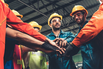 Skillful worker stand together showing teamwork in the factory . Industrial people and...