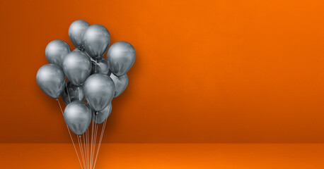 Silver balloons bunch on orange wall background. Horizontal banner.