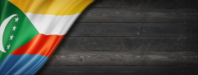 Comorian flag on black wood wall banner