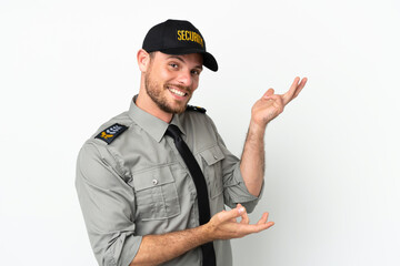 Fototapeta premium Young security Brazilian man isolated on white background extending hands to the side for inviting to come